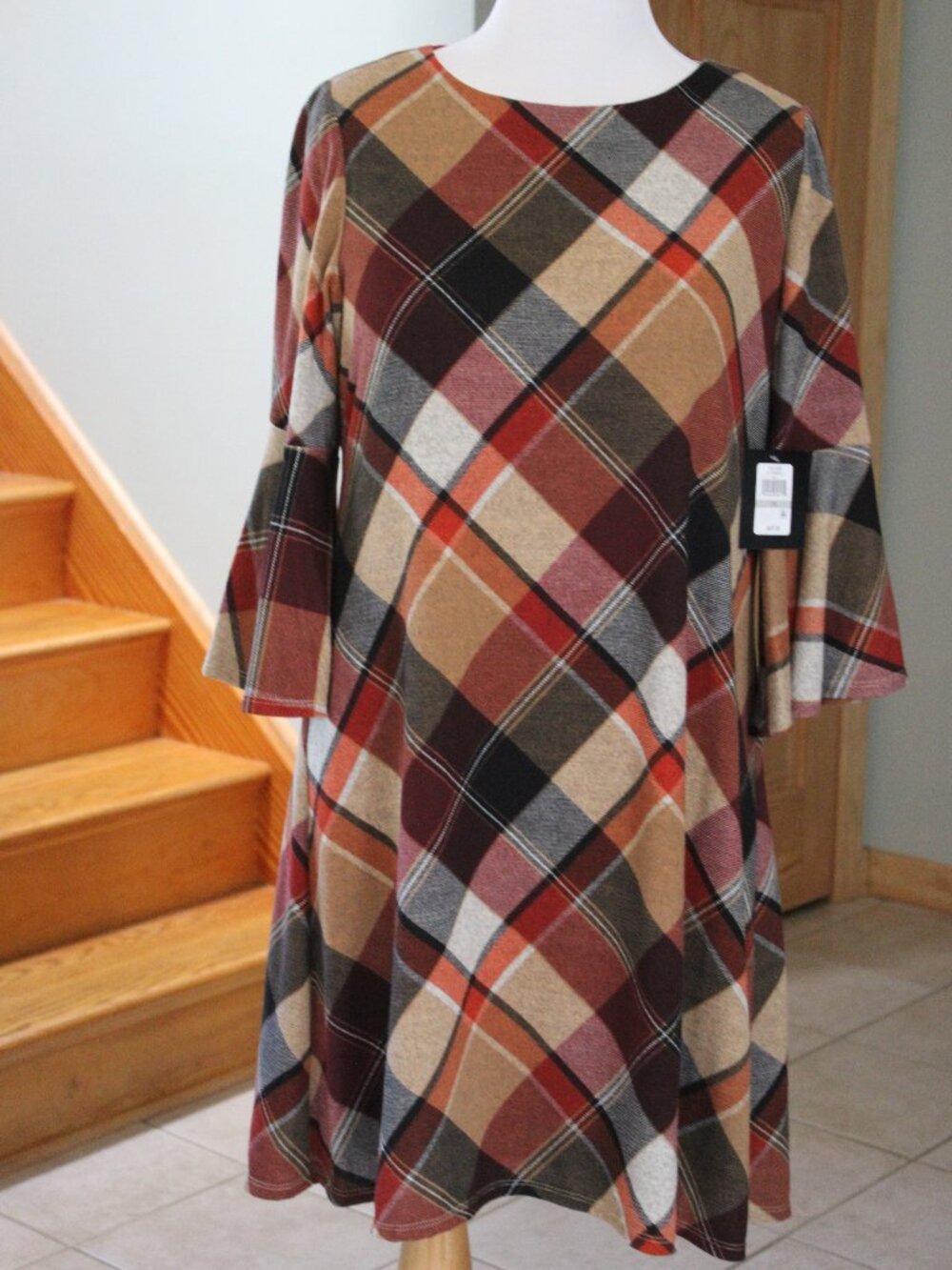 The product is a women's dress by JH, featuring a round neck, 3/4 sleeves, and a